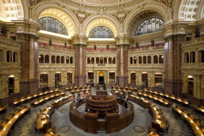 people studying in a public library reading room