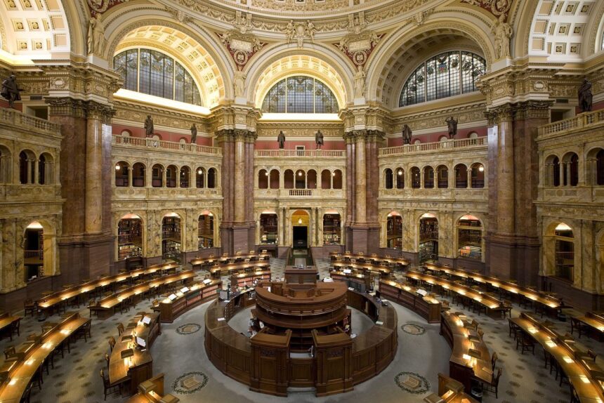 people studying in a public library reading room