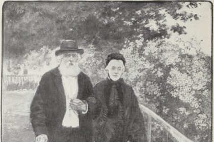 An elderly couple walking together through a green park on a sunny day