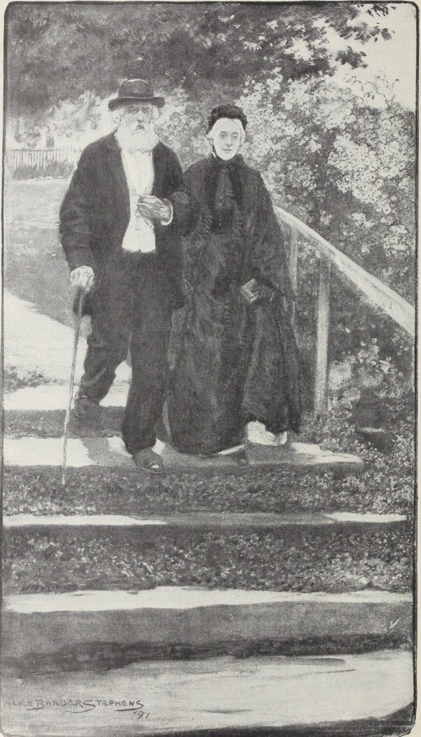 An elderly couple walking together through a green park on a sunny day