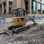 Caterpillar excavator construction photo illustrating tariff costs
