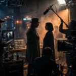 Behind the scenes on a moody thriller film set with dramatic studio lighting and cameras